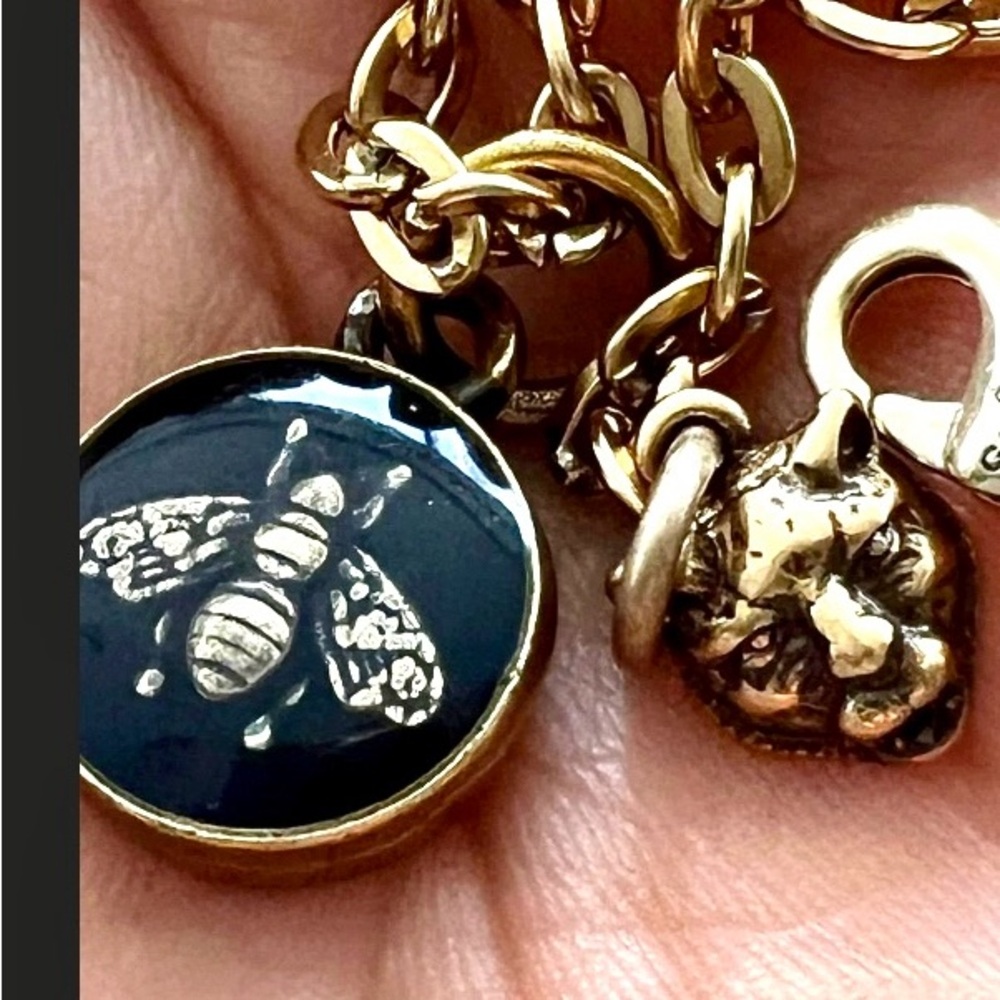Gucci Gold and Black Bee Necklace and the leopard head also on necklace